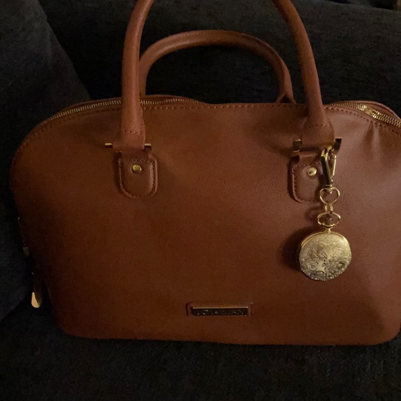 Camel color purse never used, it has several compartments inside. - Picture 1 of 4